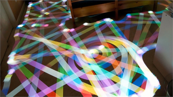 Robotic Cleaners Create Light Art